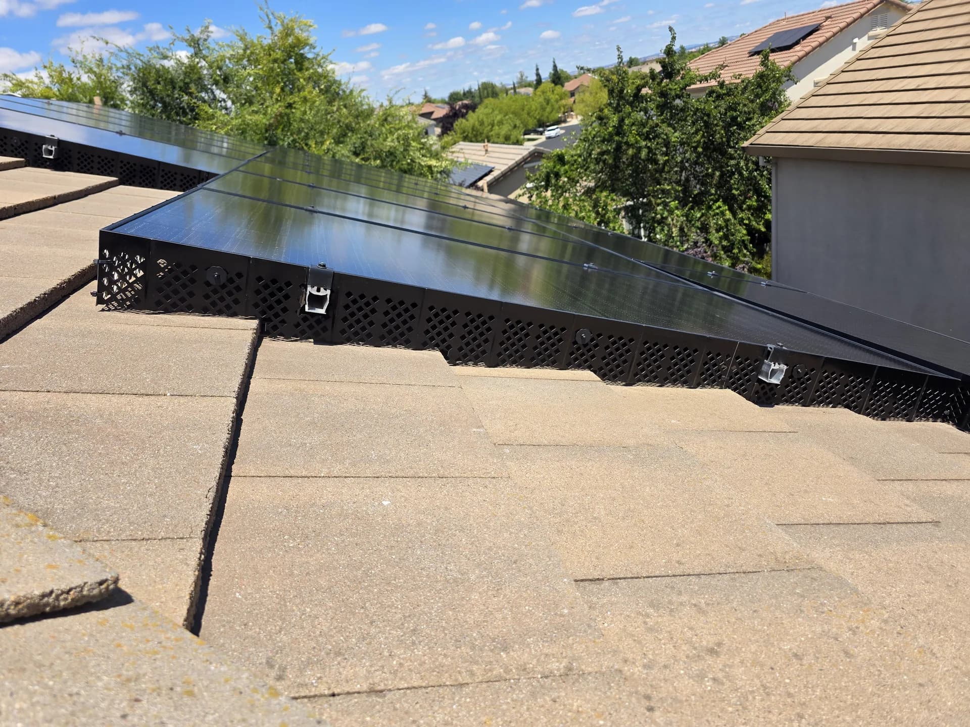 Solar birdproofing mesh installed on a composition shingle roof