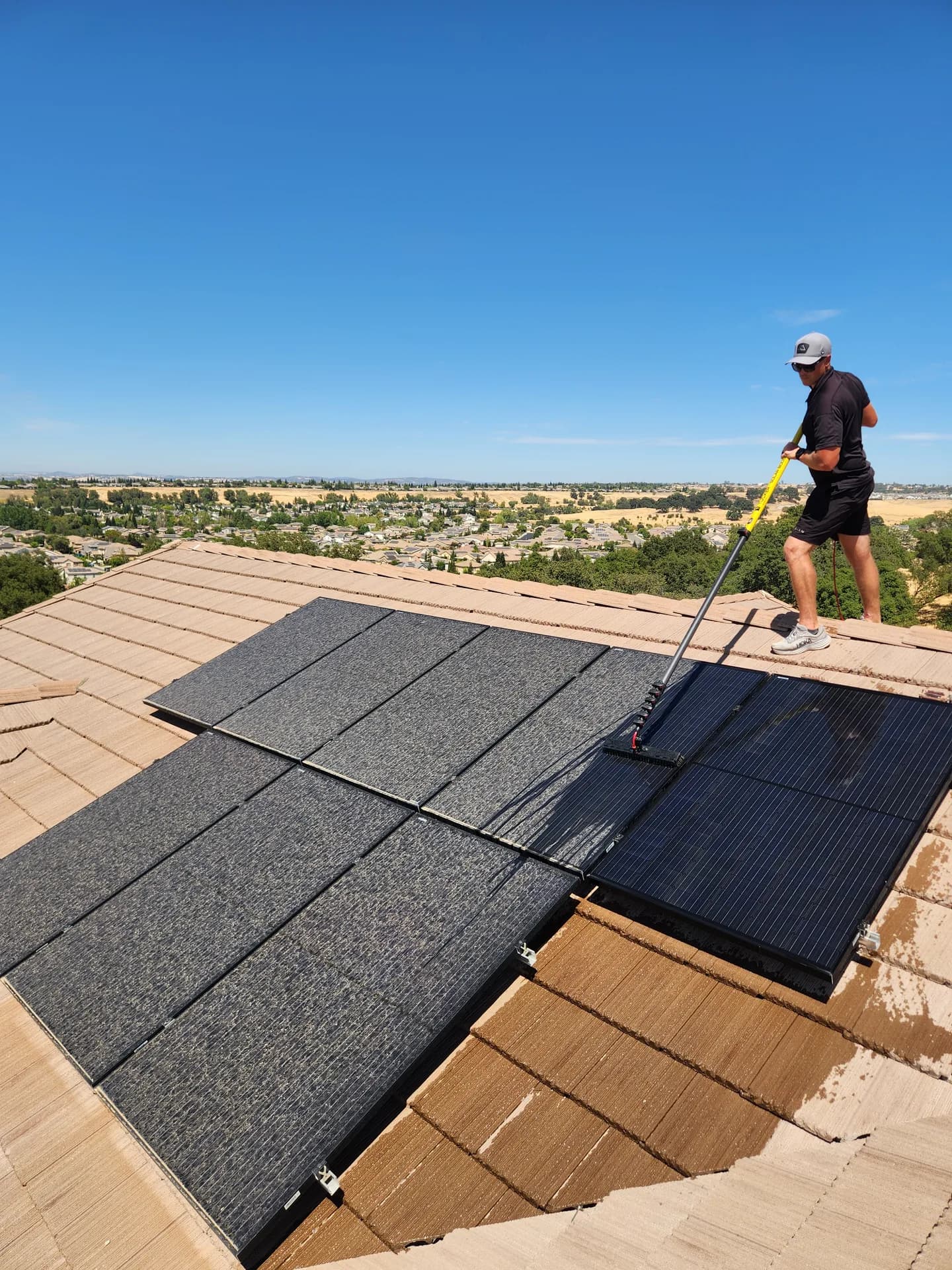 Graham soft-brush cleaning rooftop solar panels with pure water in Rocklin, CA